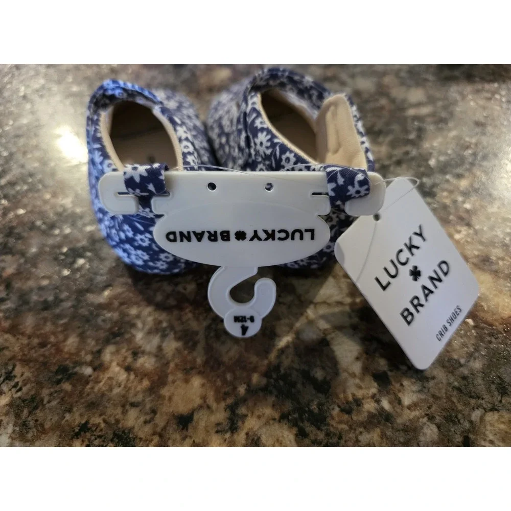 Lucky Brand. Size 4 baby girl slip on shoes. Blue and